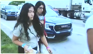 Suspect Jazmin Paez being followed by a reporter.