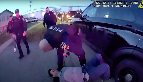 Waukegan Police Officer Richard Tabisz and suspect. Credit CBS Chicago