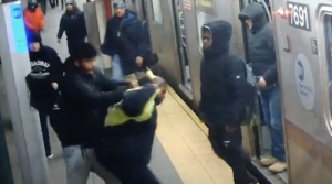 Suspect allegedly attacking MTA worker. Credit NYPD