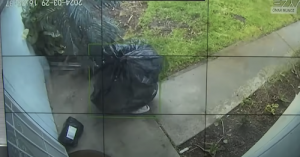 Alleged Porch Pirate Disguised as a Trash Bag Caught on Camera